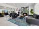 Bright living room with a unique fireplace, modern furniture, and access to other rooms at 49 Interlaken Rd, Orlando, FL 32804