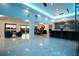 Open concept living space with a kitchen, dining area, and seating, complemented by striking blue lighting at 49 Interlaken Rd, Orlando, FL 32804