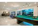 Open floor plan featuring a pool table and inviting blue accent lighting throughout at 49 Interlaken Rd, Orlando, FL 32804
