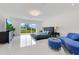 Bright main bedroom with sliding glass doors that lead to the backyard and water views at 49 Interlaken Rd, Orlando, FL 32804