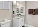 Well-lit bathroom with a vanity, mirror, and towel rack at 4984 Windermere Ave, Kissimmee, FL 34746