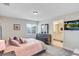 Comfortable bedroom featuring a plush bed, stylish furniture, and access to an ensuite bathroom at 4984 Windermere Ave, Kissimmee, FL 34746