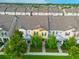 Aerial view of charming townhomes showcasing well-maintained landscaping and inviting curb appeal at 5029 Walker St, St Cloud, FL 34771