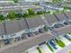 Overhead shot of townhome exteriors, garages, and driveways, nestled in a Gathering-friendly community at 5029 Walker St, St Cloud, FL 34771