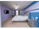Comfortable bedroom featuring modern furnishings, soothing color scheme, and great natural light at 5029 Walker St, St Cloud, FL 34771