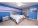 Bright bedroom featuring a cozy bed, dresser, and stylish wall decor at 5029 Walker St, St Cloud, FL 34771