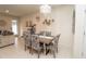 Dining area with modern light fixture is adjacent to the living area at 5029 Walker St, St Cloud, FL 34771