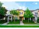 Townhome featuring pristine lawn and tidy landscaping around the walkway at 5029 Walker St, St Cloud, FL 34771