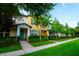Townhome featuring meticulous lawn and landscaping around the walkway at 5029 Walker St, St Cloud, FL 34771