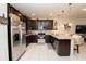 A modern kitchen boasts stainless steel appliances and granite countertops at 5029 Walker St, St Cloud, FL 34771