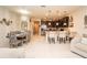 Open concept to kitchen and dining room with white tiled floors at 5029 Walker St, St Cloud, FL 34771