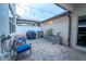 Cozy brick-paved patio with string lights, outdoor seating, and a grill perfect for entertaining at 5029 Walker St, St Cloud, FL 34771