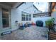 Welcoming outdoor patio space with brick pavers, comfortable seating, and string lights for evening ambiance at 5029 Walker St, St Cloud, FL 34771