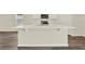 Modern kitchen island with a sink and ample counter space, ideal for food preparation and casual dining at 5099 Marshelder St, Apopka, FL 32712