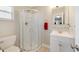 Bathroom featuring a toilet, vanity, mirror and a shower with glass doors at 5984 Ed Harris Ct, St Cloud, FL 34771
