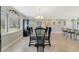 Elegant dining area with stylish table and chairs, next to a large bright window at 5984 Ed Harris Ct, St Cloud, FL 34771