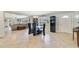 Elegant dining room with a glass table and an adjacent open living area at 5984 Ed Harris Ct, St Cloud, FL 34771