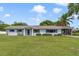 Charming single-story home with blue shutters and a well-manicured lawn at 5984 Ed Harris Ct, St Cloud, FL 34771