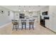 Bright and spacious kitchen with white cabinets, granite countertops, and modern appliances at 5984 Ed Harris Ct, St Cloud, FL 34771