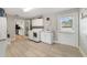 Bright laundry room with modern washer and dryer, sink, and convenient outdoor access at 5984 Ed Harris Ct, St Cloud, FL 34771