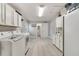 Spacious laundry room with white cabinets, new appliances, and tile flooring at 5984 Ed Harris Ct, St Cloud, FL 34771