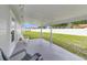 Relaxing covered patio overlooking a spacious backyard with a privacy fence at 5984 Ed Harris Ct, St Cloud, FL 34771