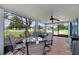Inviting screened porch with comfortable seating, perfect for outdoor dining and relaxation at 5984 Ed Harris Ct, St Cloud, FL 34771
