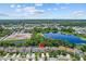Aerial shot of the home's location, showcasing proximity to a scenic lake and surrounding community at 672 Seven Oaks Blvd, Winter Springs, FL 32708