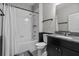 Bathroom with a shower-tub combo, dark vanity, and granite countertop at 672 Seven Oaks Blvd, Winter Springs, FL 32708