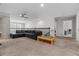 Upstairs bedroom featuring a leather couch, carpet, and railing at 672 Seven Oaks Blvd, Winter Springs, FL 32708