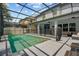 Relaxing pool with seating area surrounded by a screened enclosure at 672 Seven Oaks Blvd, Winter Springs, FL 32708