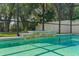 Screened in pool with a stacked stone water feature and lush, mature landscaping at 672 Seven Oaks Blvd, Winter Springs, FL 32708