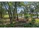 Lush and serene view of a tranquil lake from the backyard of the property at 672 Seven Oaks Blvd, Winter Springs, FL 32708