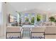 Inviting living room with large windows, comfortable seating, and stylish decor, perfect for relaxation and entertaining at 744 Curly Locks Loop, Apopka, FL 32703