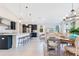 Bright, open living area with a modern kitchen, a dining table and a cozy living space featuring lots of natural light at 744 Curly Locks Loop, Apopka, FL 32703