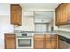 Updated kitchen offering wood cabinetry, stainless steel appliances, and granite counters at 8040 Sagebrush Pl, Orlando, FL 32822