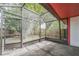 The home's screened-in porch leads to the fenced backyard with lush green landscaping and a well-maintained outdoor space at 8040 Sagebrush Pl, Orlando, FL 32822