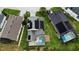 Aerial view of the home highlighting a pool, lanai, and roof-mounted solar panels at 831 Corvina Dr, Davenport, FL 33897