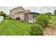 The backyard includes a pool, screened-in lanai, and well-maintained landscaping at 831 Corvina Dr, Davenport, FL 33897