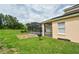 The backyard offers an outdoor living space with a pool and a screened lanai at 831 Corvina Dr, Davenport, FL 33897