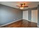 Bedroom showcasing gray walls, hardwood floors, and a double-door closet at 831 Corvina Dr, Davenport, FL 33897