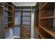 A walk-in closet with custom shelving and hanging racks, maximizing storage space at 831 Corvina Dr, Davenport, FL 33897