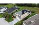 Exterior elevation showing a lovely two-story home with a garage and solar panels at 831 Corvina Dr, Davenport, FL 33897