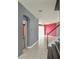 Hallway with tile flooring, leading to stairs and multiple rooms with an open feel at 831 Corvina Dr, Davenport, FL 33897