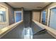 Upstairs hallway with view of bathroom, bedrooms, and the stairway at 831 Corvina Dr, Davenport, FL 33897