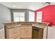 Kitchen island and countertops with stainless steel appliances and tile flooring at 831 Corvina Dr, Davenport, FL 33897
