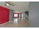 Large living area featuring tile floors, bright walls, and an open layout leading to dining and stairs at 831 Corvina Dr, Davenport, FL 33897