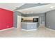 Bright living room area boasts an open concept with tile flooring and neutral color palette at 831 Corvina Dr, Davenport, FL 33897