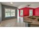 Open living space with granite counters overlooking a view of the pool and back yard at 831 Corvina Dr, Davenport, FL 33897