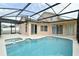 Covered pool area, with adjacent jacuzzi, perfect for outdoor relaxation and entertainment at 831 Corvina Dr, Davenport, FL 33897
